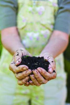 Woman with handful of compost